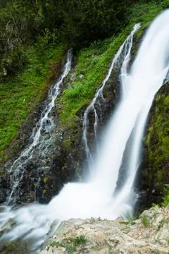 Waterfall and small cascade in forests of Washington State Stock Photos