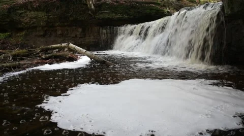 Waterfall and a spinning circle of foam Stock Footage 44231035
