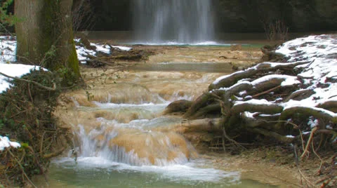 Waterfall and stream in the winter forest. Stock Footage 27074764
