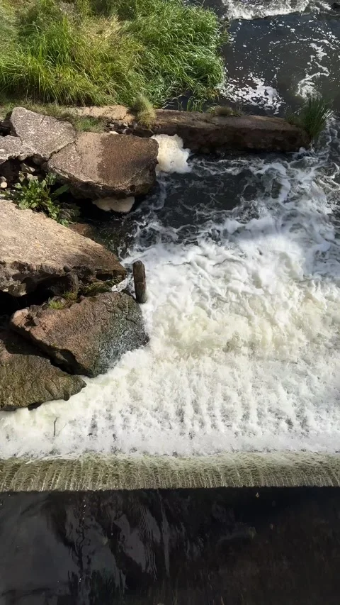 Waterfall and view from bridge at Belmotas in Vilnius. Vertical footage Stock Footage 217681632