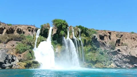 Waterfall in Antalya flows into the Mediterranean sea. Coastal cliff landsc.. Stock Footage 333554245