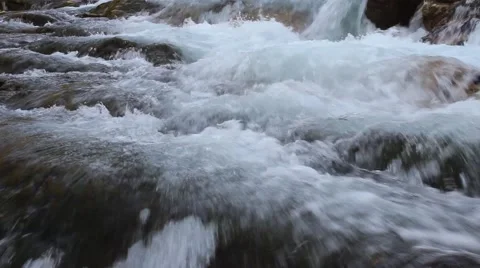 Waterfall in the austrian mountains flows powerful over the rocks 库存影片 40026882