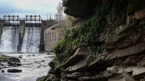 Waterfall in the autumn forest. Old micro hydro power plant Stock Footage 74009930