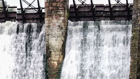 Waterfall in the autumn forest. Old micro hydro power plant Stock-Footage 74011255