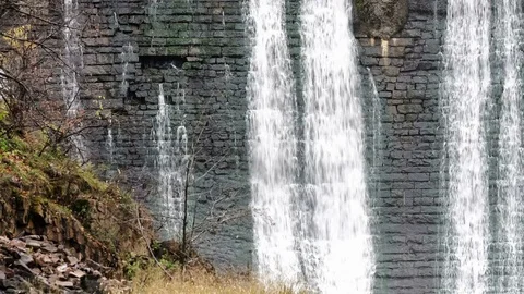 Waterfall in the autumn forest. Old micro hydro power plant Video stock 74012687