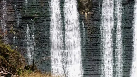 Waterfall in the autumn forest. Old micro hydro power plant Stock Footage 74012841