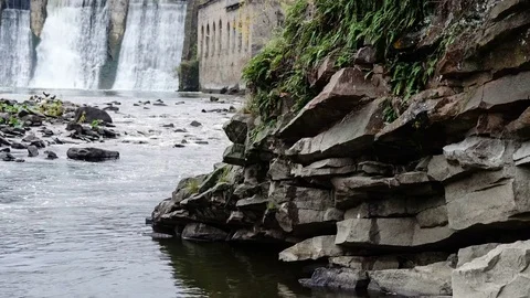 Waterfall in the autumn forest. Old micro hydro power plant Stock Footage 74013204