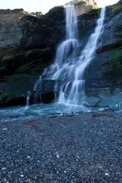 Waterfall by beach Stock Photos