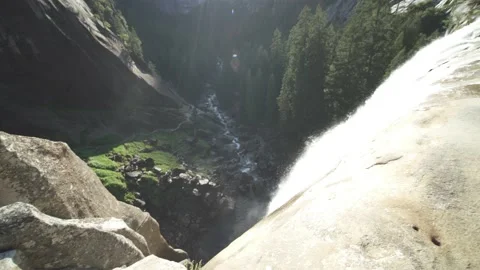 Waterfall with Beautiful Mountains and Trees in Horizon with Lens Flare Stock Footage 142319657