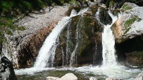 A waterfall with beautiful rocks in the mountains Stock-Footage 219351703