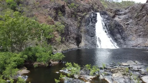 A waterfall being filmed while the camera is slowly moving upwards Stock Footage 135483983