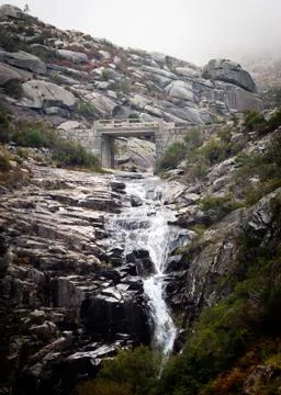 Waterfall Below Stone Bridge Stock Photos