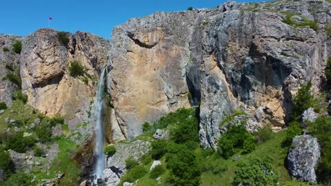 Waterfall between Rocks on a Hill Stock Footage 247957821