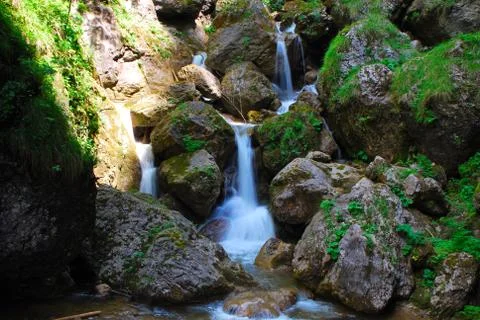 Waterfall between rocks Stock Photos