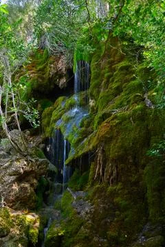 A waterfall between rocks Stock Photos