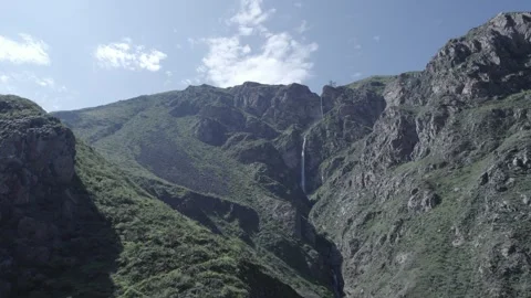 WATERFALL IN A BIG MOUNTAIN Stock Footage 326227547