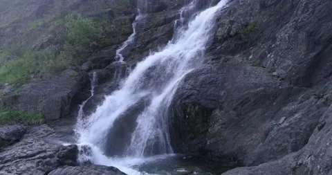 Waterfall on the big rocks. Camera moves away. Ural mountains Stock Footage 269539958