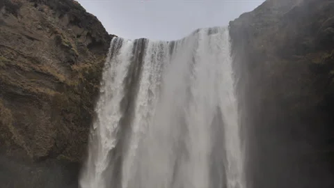 A waterfall with a bird flying above it Stock Footage 301791449