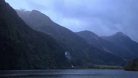 Waterfall blown in Wind Over Harbor, Doubtful Sound Stock-Footage 320994145