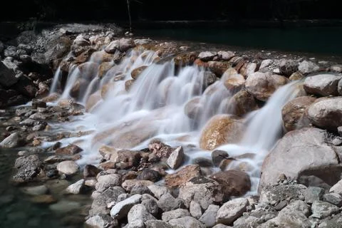 A waterfall blurred with long exposure Stock Photos