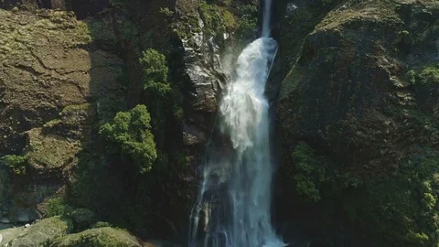 Waterfall breaks up at rocks, splashes and splatters around Stock Footage 124680043