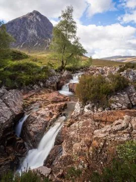 Waterfall with Buachaille etive mor, Glen Coe, Scotland, UK Stock Photos