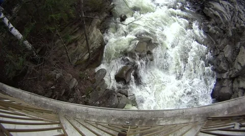 Waterfall is bubbling - view from a bridge Stock Footage 49552361