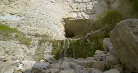 A waterfall caming out of a cave at Afka, Lebanon. Slow motion Stock Footage 134295869