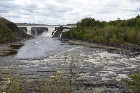 Waterfall in Canada with river and rocks and trees Stock Photos