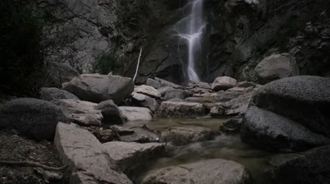 Waterfall in canyon timelapse 2 Stock Footage 60730809