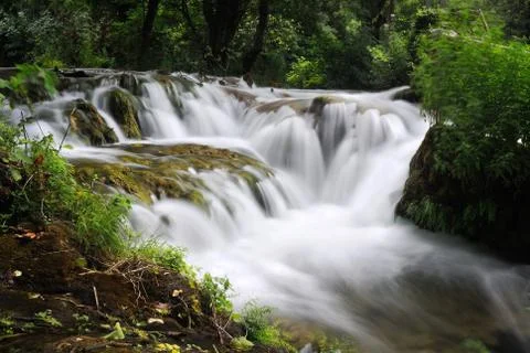 Waterfall cascade from close view in forrest Stock Photos