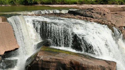 The waterfall cascade on mountain rocks. Beautiful waterfall flowing over rocks. Stock Footage 257415948