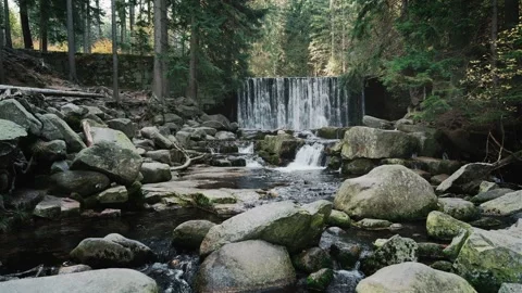 Waterfall, cascades and artificial river dam on a mountain river in forest Stock Footage 250035248