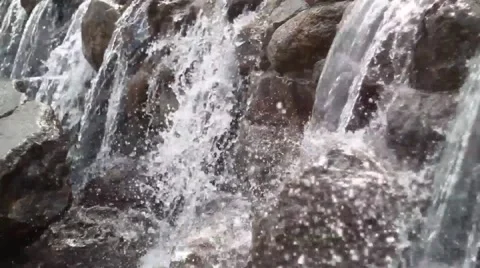 Waterfall cascades flowing over flat rocks Stock Footage 49734708