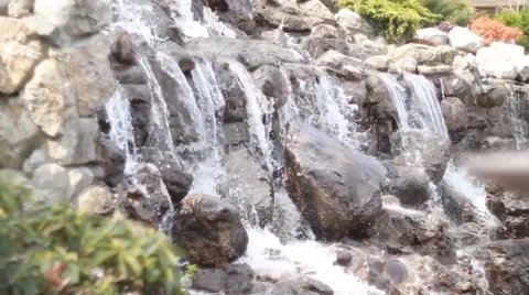 Waterfall cascades flowing over flat rocks Vídeo Stock 49734728