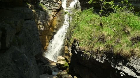 Waterfall cascades into a gorge Stock-Footage 260815361