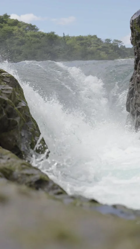 Waterfall Cascading Between Mossy Rocks Stock Footage 308576330