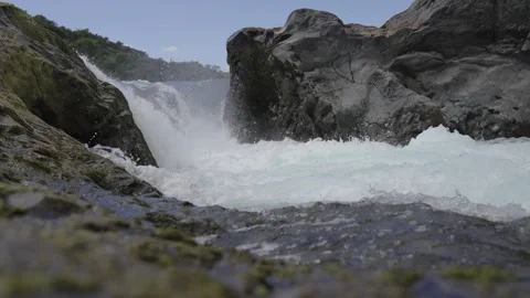 Waterfall Cascading Between Mossy Rocks Stock Footage 308578941