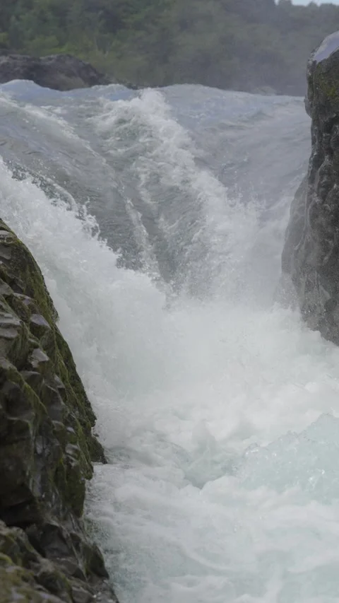 Waterfall Cascading Between Mossy Rocks Stock Footage 308579818