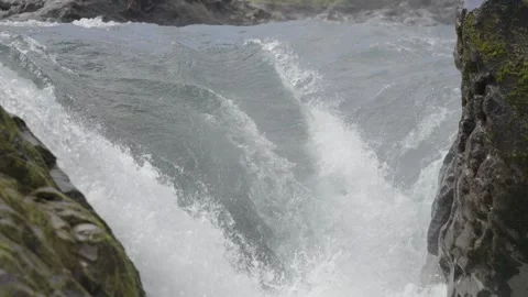 Waterfall Cascading Between Mossy Rocks Stock Footage 308580756