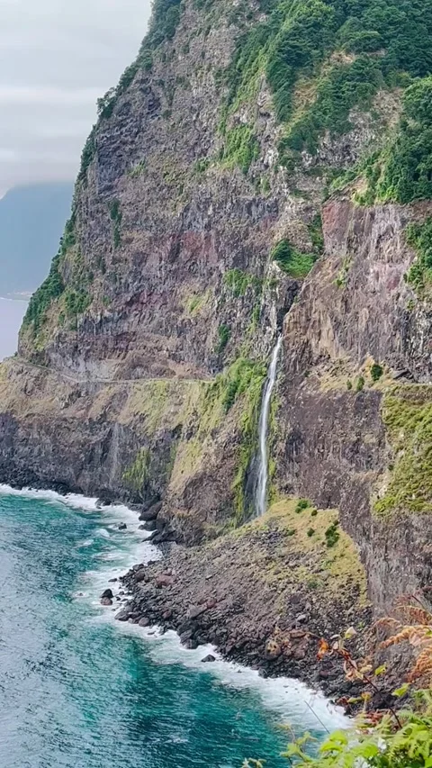 Waterfall cascading down a cliff Stock Footage 315222504