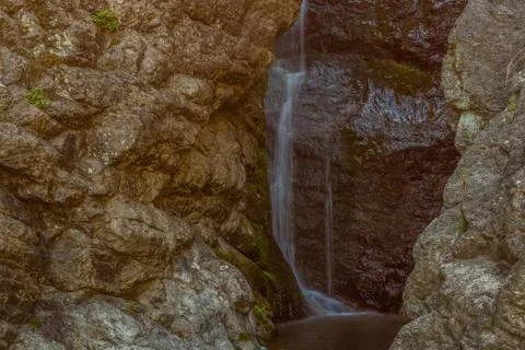 Waterfall cascading down granite wall Stock Photos