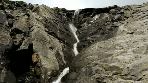 Waterfall Cascading Down Ravine Headwall Video stock 12292179