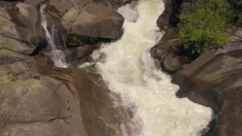 Waterfall Cascading Down Rocks In Segade - Drone Shot Stock Footage 310833481