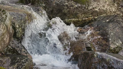 Waterfall Cascading Down Rocky Terrain. Stock Footage 332136113
