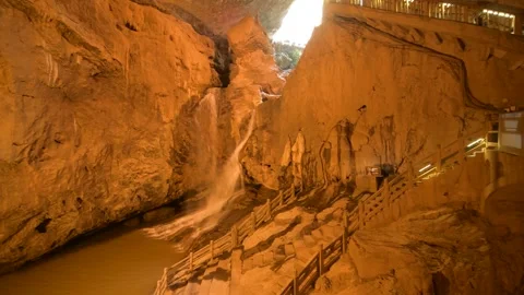 Waterfall cascading inside a large limestone cave in Jiuxiang Scenic Area China Stock Footage 342278252