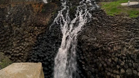 Waterfall Cascading Over Basalt Columns in Mexico Nature Landscape Close Up View Stock Footage 336375120