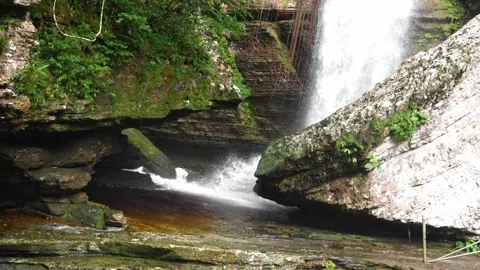 Waterfall Cascading Over Rock Formation in Guaviare Stock Footage 336521126