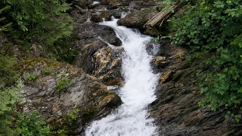 Waterfall cascading over rocks 4K Stock Footage 111168828