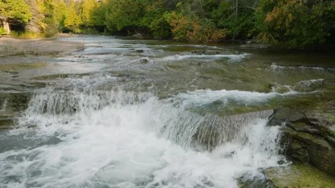 Waterfall cascading through the forest Stock Footage 256941948